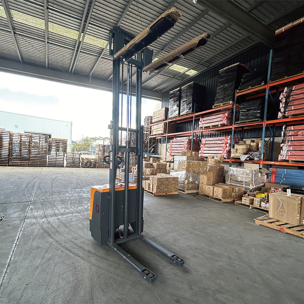 Stand-up electric stacker with 3-meter lift height and 1500kg capacity. Designed for efficient material handling in warehouses, featuring durable construction, ergonomic controls, and compact design for easy maneuverability.