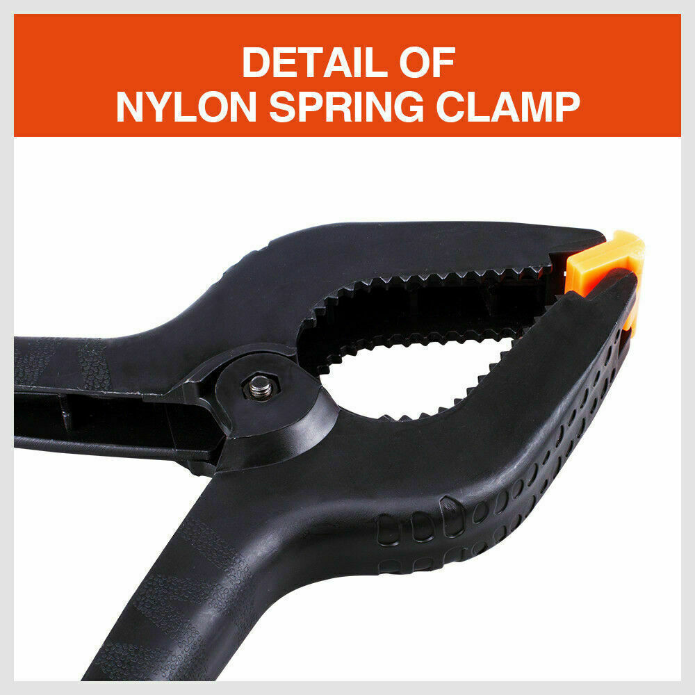 Four-piece set of 9-inch black heavy-duty nylon spring clamps, showcasing their strong, quick grip design and large size, suitable for a variety of clamping tasks