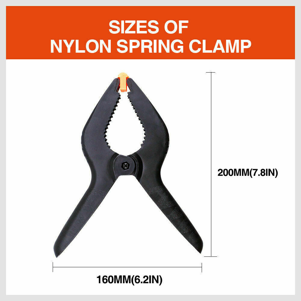 Four-piece set of 9-inch black heavy-duty nylon spring clamps, showcasing their strong, quick grip design and large size, suitable for a variety of clamping tasks