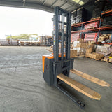 Stand-up electric stacker with 3-meter lift height and 1500kg capacity. Designed for efficient material handling in warehouses, featuring durable construction, ergonomic controls, and compact design for easy maneuverability.