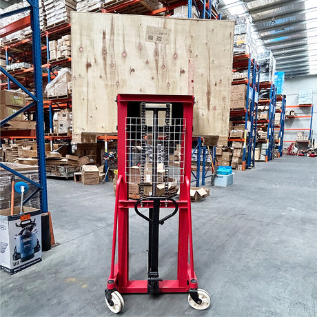Manual hydraulic stacker lift truck, with 2m lift height and 500kg capacity. Ideal for material handling in warehouses and workshops, featuring durable red frame, compact design, and easy maneuverability