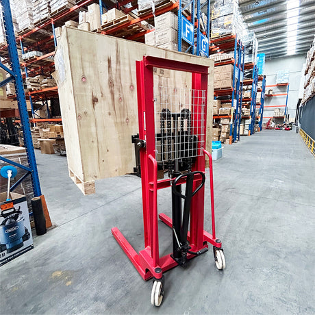Manual hydraulic stacker lift truck, with 2m lift height and 500kg capacity. Ideal for material handling in warehouses and workshops, featuring durable red frame, compact design, and easy maneuverability