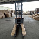 Stand-up electric stacker with 3-meter lift height and 1500kg capacity. Designed for efficient material handling in warehouses, featuring durable construction, ergonomic controls, and compact design for easy maneuverability.