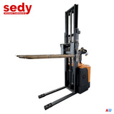 Stand-up electric stacker with 3-meter lift height and 1500kg capacity. Designed for efficient material handling in warehouses, featuring durable construction, ergonomic controls, and compact design for easy maneuverability.